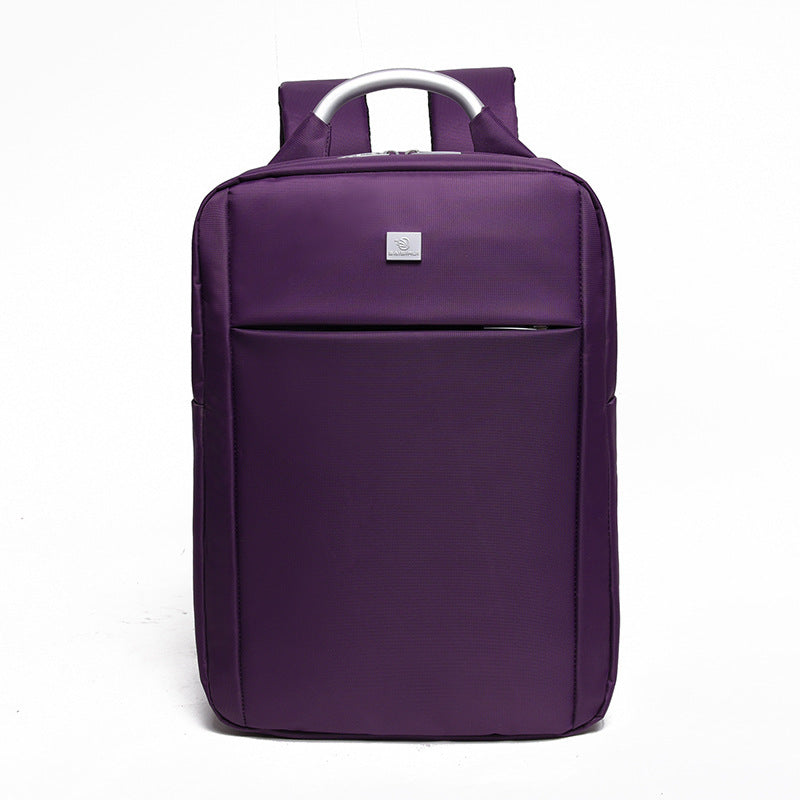Purple backpack with a silver handle on a white background