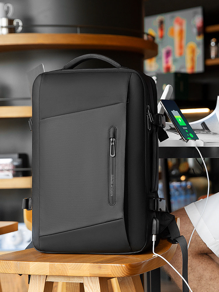 Black backpack on a wooden stool with a blurred background