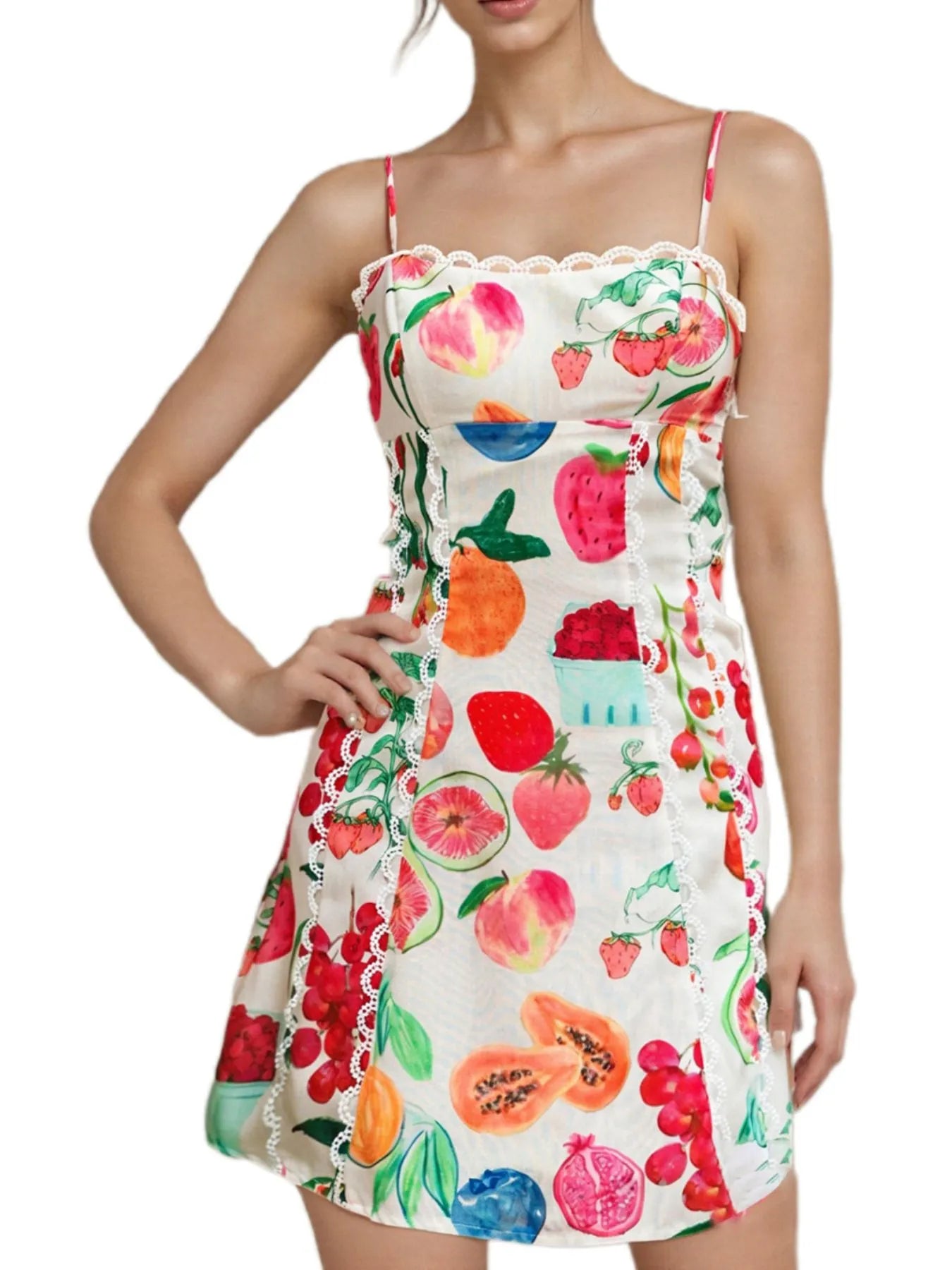 Woman wearing a colorful fruit-patterned dress on a white background