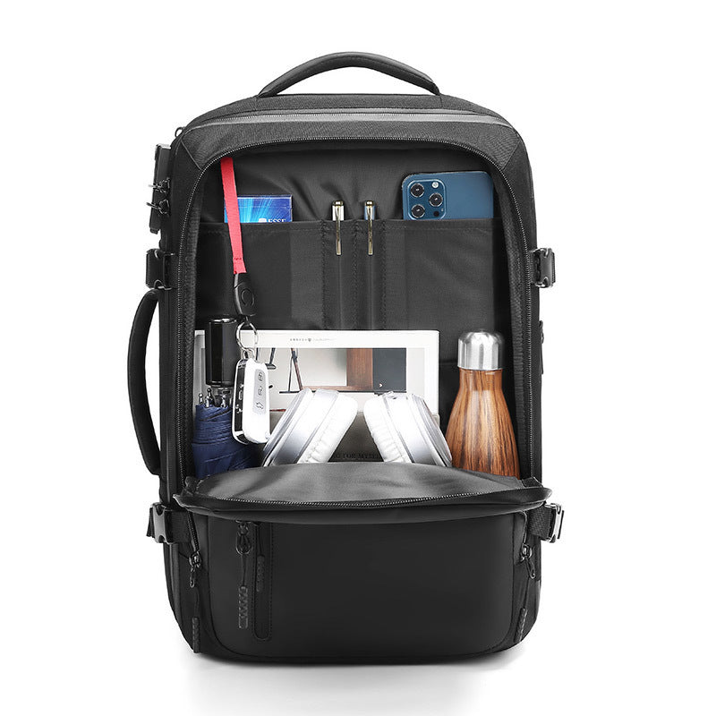 Black backpack with various items organized inside on a white background